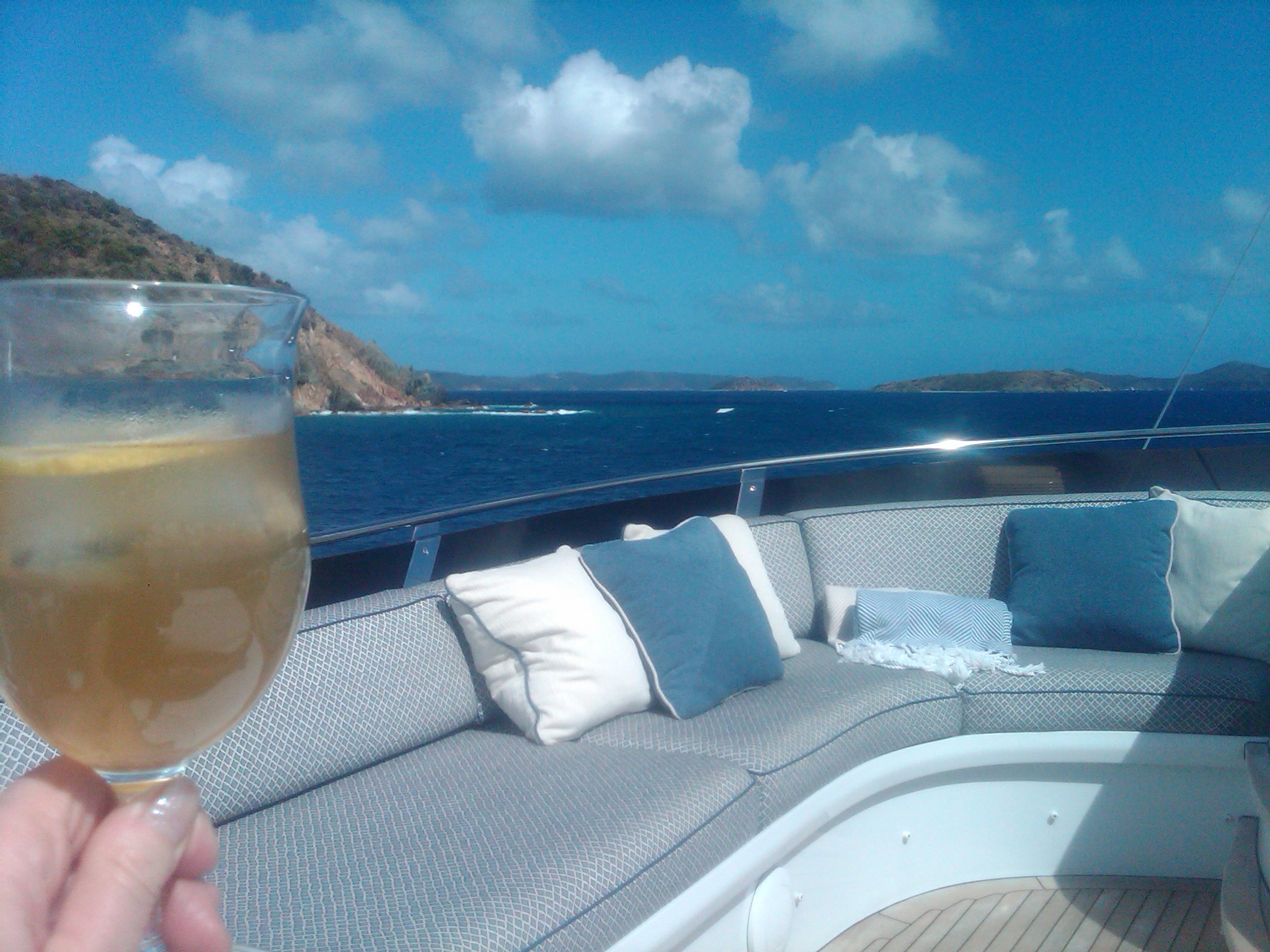 Wine glass held over aft deck of motor yacht 130ft SWEET ESCAPE