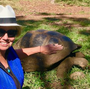 Carol with Galápagos land tortoise (world's largest) reaching over 4.2ft and 660 lbs.