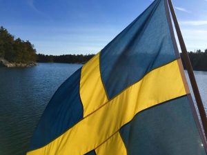 SwedishFlagWaterBehind_sail yacht ichiban menu
