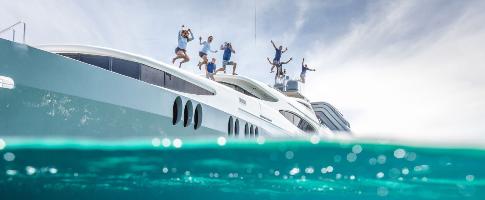Family jumping into Caribbean from M/Y ZOOM ZOOM ZOOM