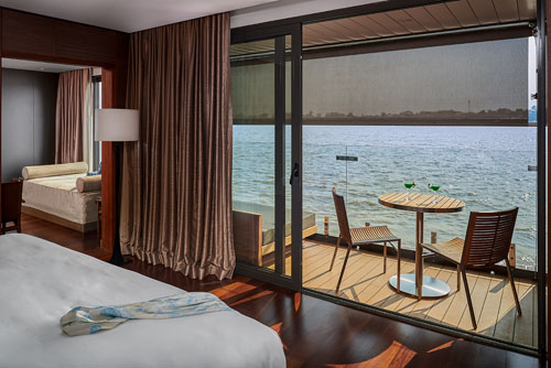 Connecting suite with floor-to-ceiling windows on the Aqua Mekong cruise on the Mekong River