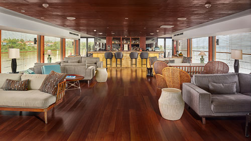 Indoor lounge and bar on the 5-star AQUA MEKONG cruise on the Mekong River