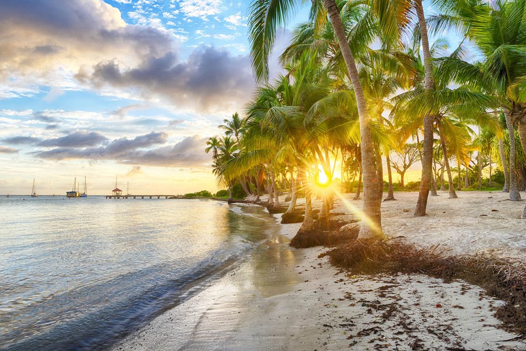 Sunset over Anse Champagne beach in Saint Francois, Guadeloupe, Caribbean