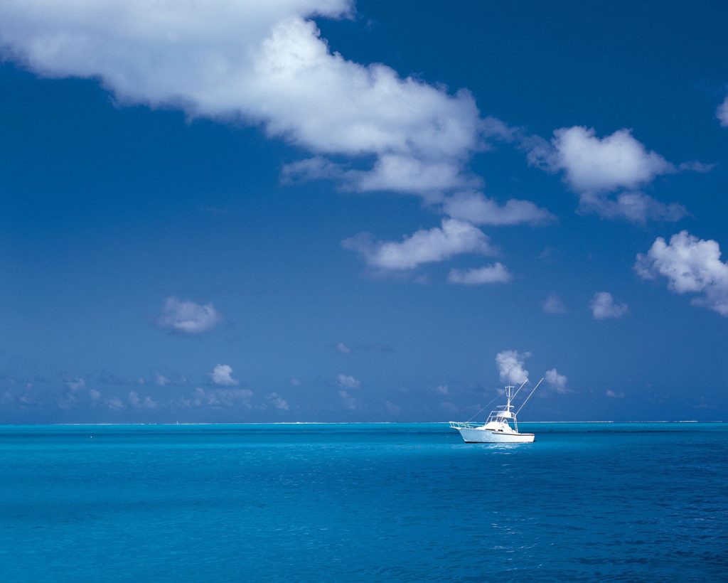 White Boat On Teal Blue Water Caribbean