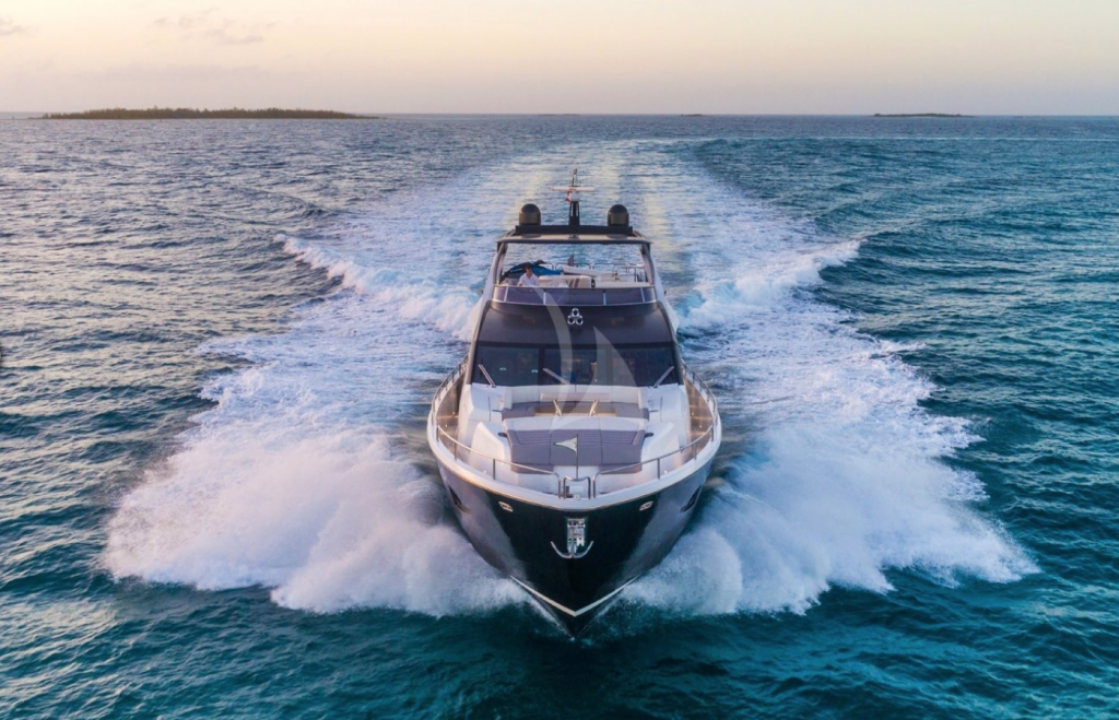 The motor yacht ENTERPRISE moving at full speed on the ocean at dusk