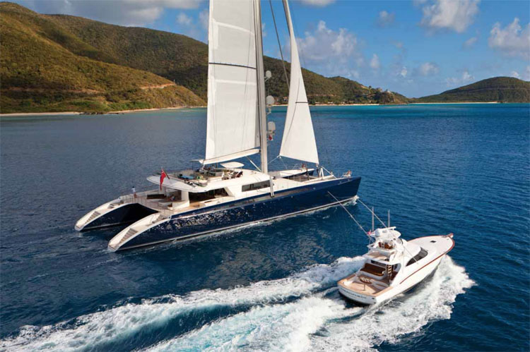 Tender alongside 145ft HEMISPHERE - the world's largest sailing catamaran