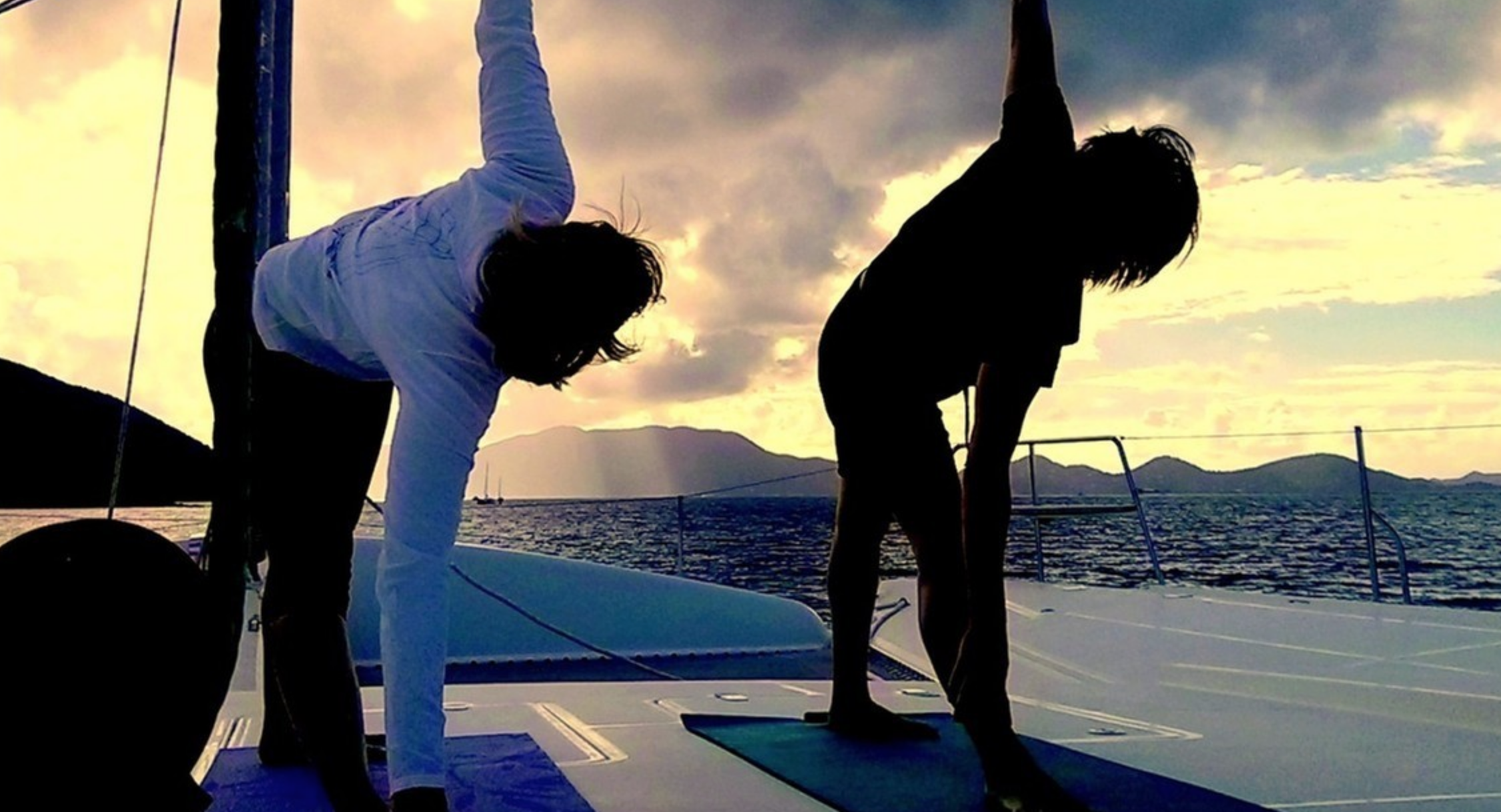 Sunrise yoga on the deck of the sailing yacht ORION