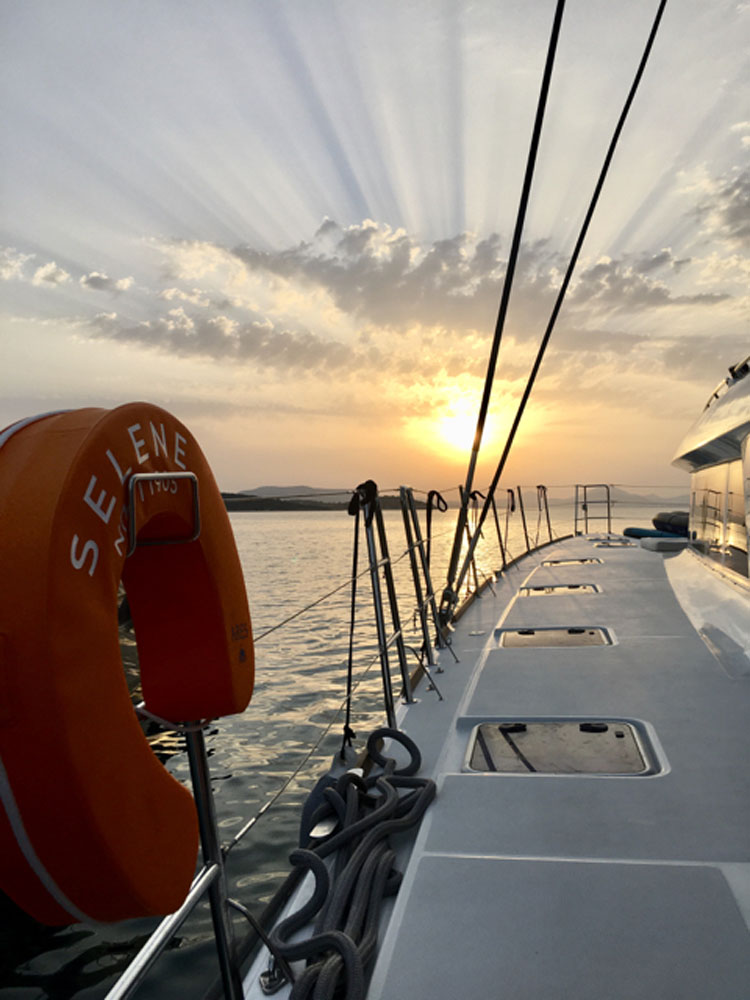 Sunset on the mythological Peloponnese in Greece from the deck of the 62' catamaran SERENE