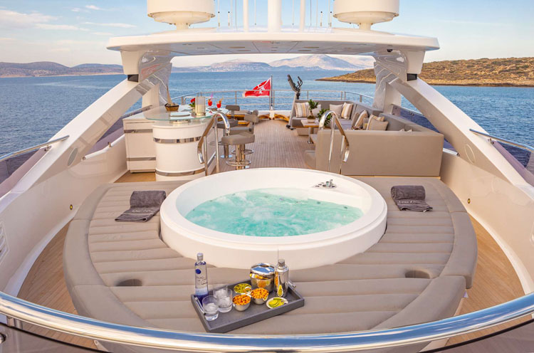 Jacuzzi deck with snacks for guests on the 131 foot motor yacht AQUA LIBRA