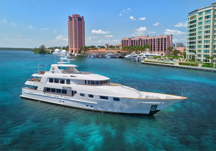 Main shot of 142ft motor yacht AQUASITION cruising Operating in the Bahamas and the North America