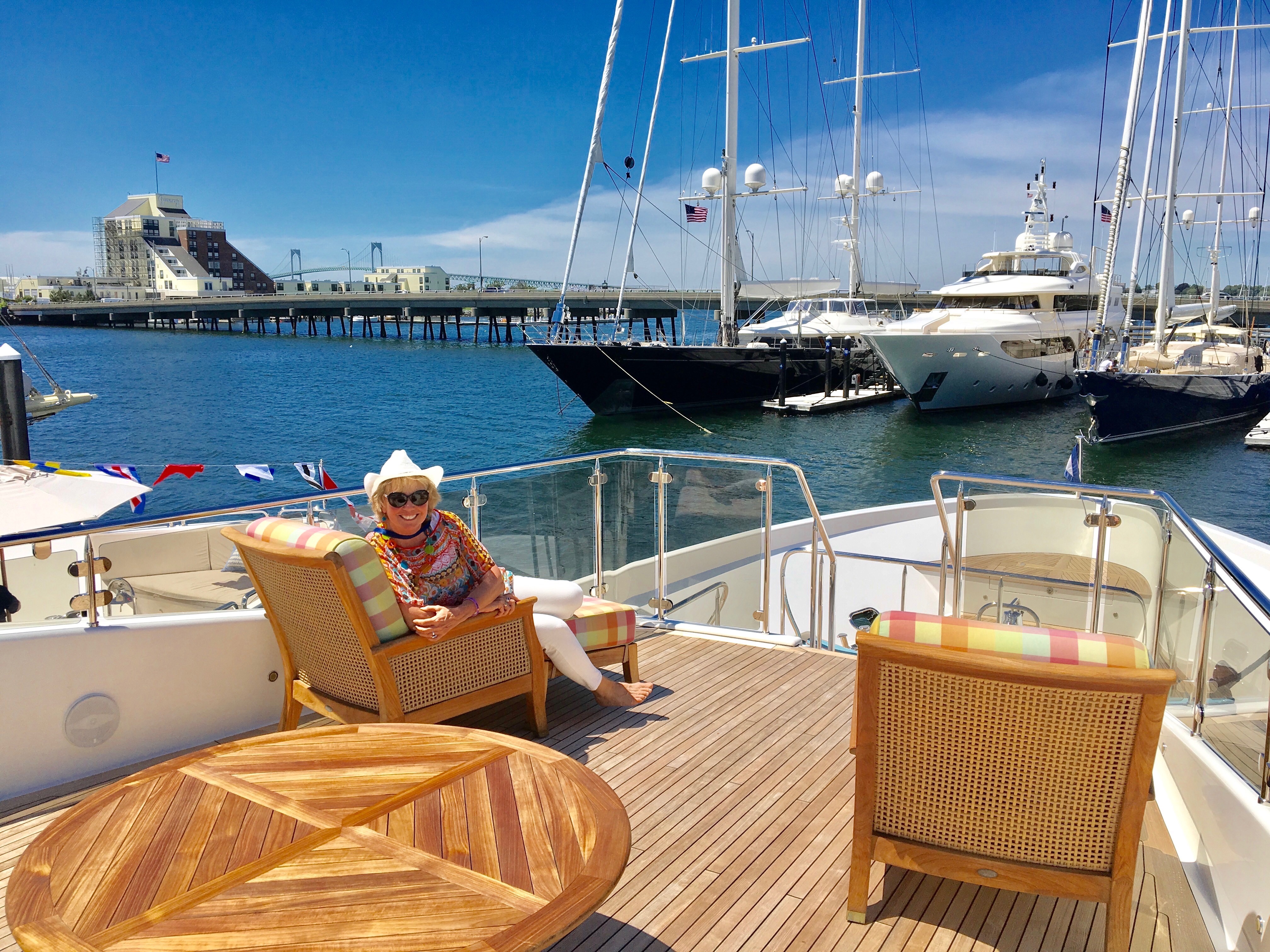 Carol Kent in a comfy chair on board a yacht deck in Newport, Rhode Island
