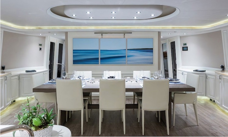 Dining area with ocean triptych on the 112ft Westport_motor yacht BOXER