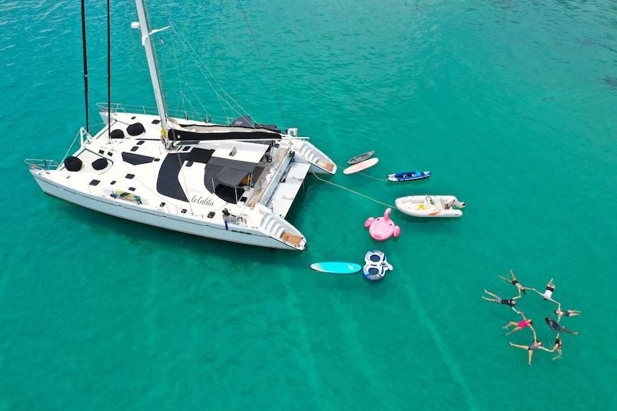 Lolalita with toys and floating friends and family circle 65ft Sailing catamaran