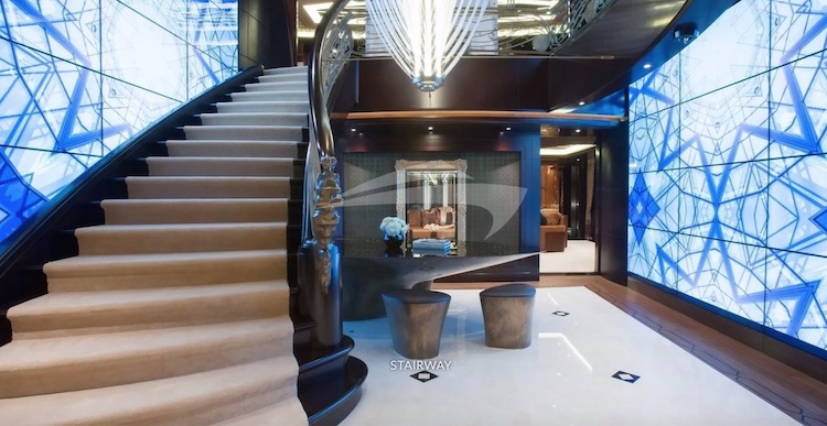 Stairway with blue and white glass walls on 312ft Lurssen motor yacht KISMET