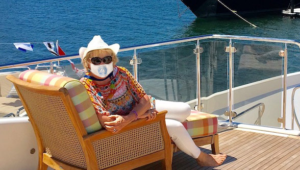 Carol Kent yacht charter broker wearing a COVID mask on deck of yacht in Newport, Rhode Island