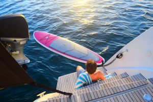 A standup paddleboard awaits a STOP WORK ORDER guest off the aft deck in St. Croix, USVI