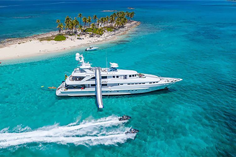 145ft Heesen motor yacht AT LAST with slide and jet skis operates in the Caribbean