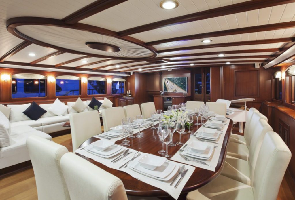 Beautiful table setting in dining room of motor sailer yacht