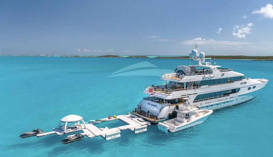 157ft Christensen motor yacht MI AMORE with its many toys and tenders on the water
