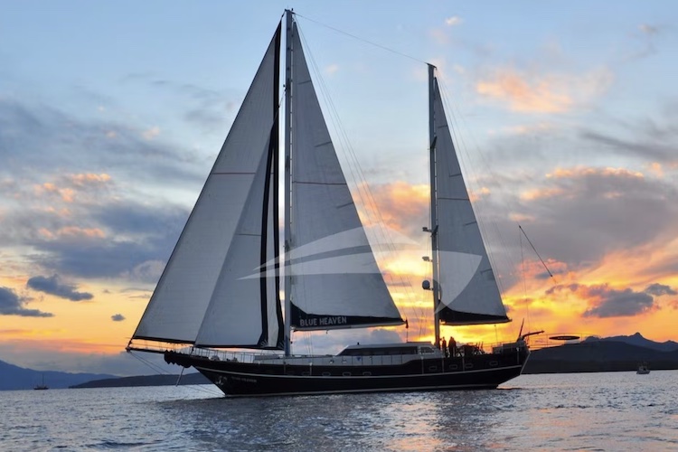 98ft Mavi Rota Yachting sailing yacht BLUE HEAVEN on the water at sunset
