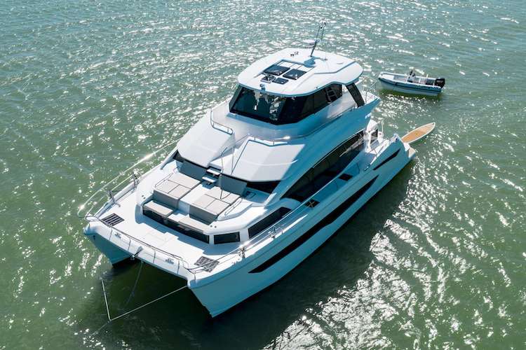 54ft custom built in 2022 motor yacht TIAMO on the water with tender