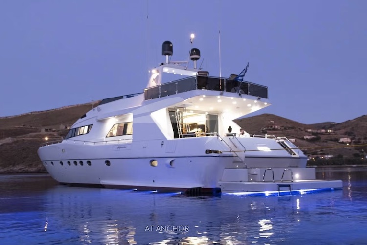 92ft Alfamarine motor yacht WISH on the water at dusk with elegant night illumination