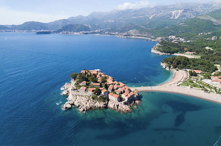 Aerial view of fortified island village and causeway of Sveti Stefan, Montenegro
