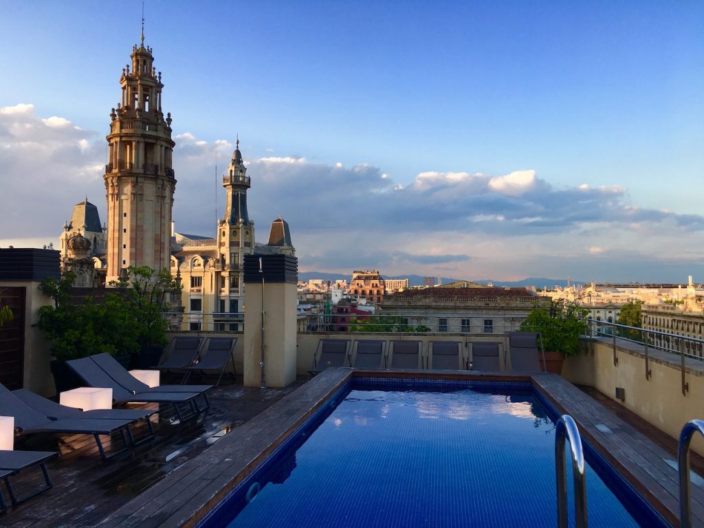 Gothic cathedral and skyline from rooftop pool in Barcelona, Spain photo©carolkent.com