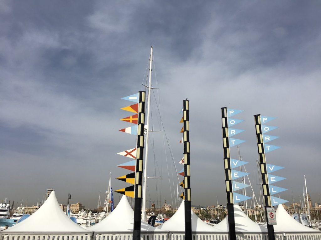 Port Vell flags on tents at the 2023 MYBA Charter Show in Barcelona photo©carolkent.com