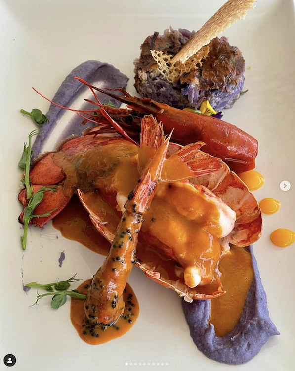 Gorgeous presentation of prawn like a whale's tail and lobster with purple sauce at MYBA Superyacht Chefs' Competition 2023 photo©patsakellari