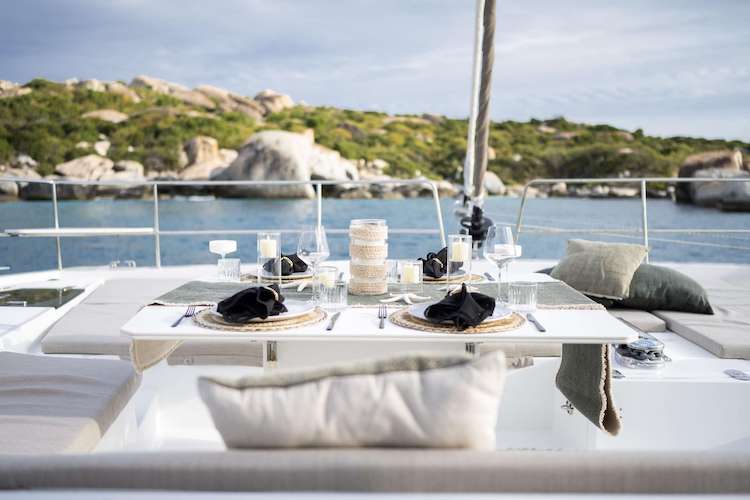 Tablesetting on aft deck of 55ft Bali 5.4 sailing catamaran HIGH 5, operating in the Caribbean