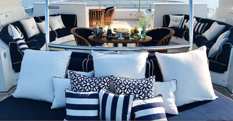 Aft deck lounge with tablesetting and champagne on 129ft Hessen motor yacht LADY AZUL