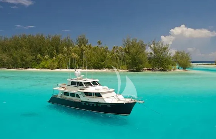 75ft Marlow motor yacht MISS KULANI on turquoise water, operating in Oceania