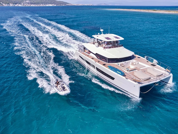 67ft Fontaine Pajot motor catamaran ELLY and her tender at sea