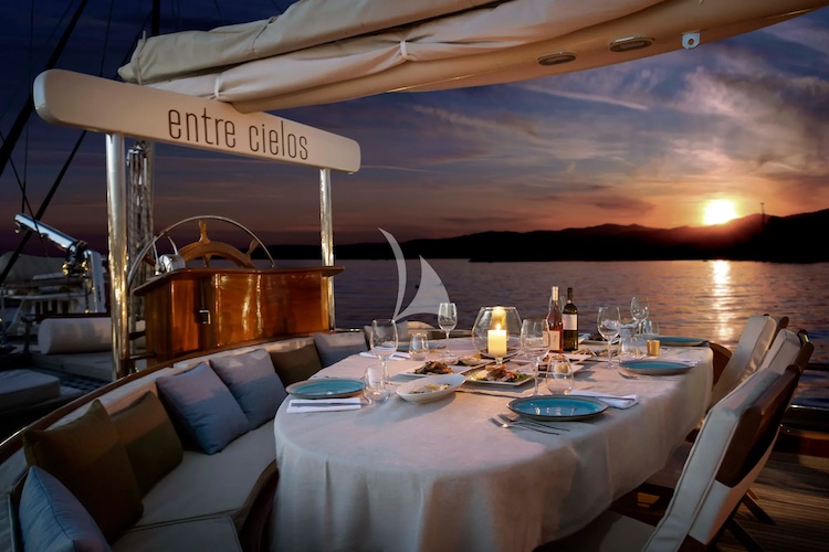 Dinner at sunset in Greece on the aft deck of 104ft motor sailer ENTRE CIELOS