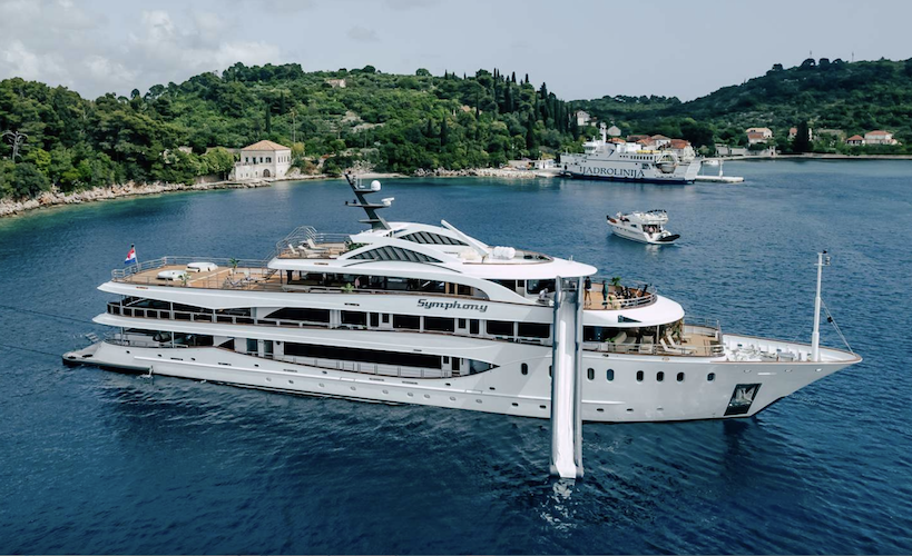 172ft custom-built motor yacht SYMPHONY at anchor with slide sleeps 30 guests